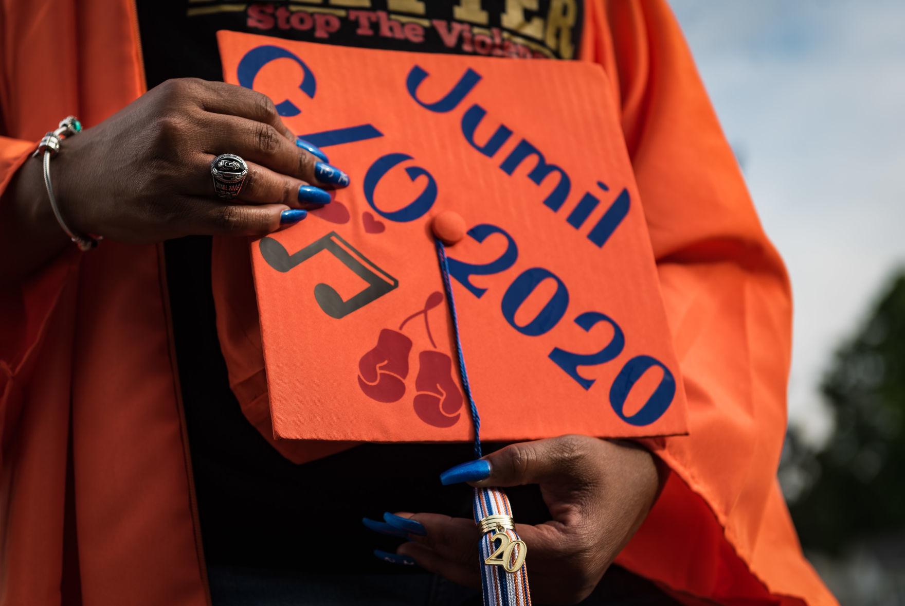 Nakeshia Collins accepts Glenn diploma for son Jumil Robertson